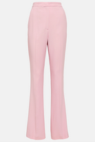 Pastel pink women’s trousers with fitted waistband and bell-bottom silhouette.