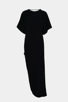 Elegant fitted maxi dress featuring short dolman sleeves and a round neckline.