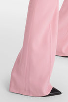 Chic pink crepe pants featuring side slits and back pockets.