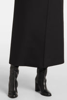 Clara Black Virgin Wool Coat featuring a sophisticated midi-length design and elegant oversized flap.