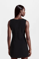 Sleek black mini dress with asymmetric neckline, made in Madrid