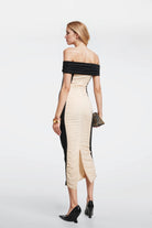 Chic black and beige dress designed in Madrid for a flattering fit.