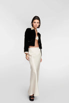 A-line flowing white silk skirt for sophisticated styling.