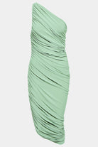 Elegant green shirred dress with a textured, figure-flattering fit.