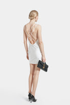 Elegant Ava White Satin Backless Slip Dress featuring a straight cut and crossed straps.