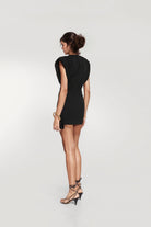 Madrid-made black jersey mini dress for special occasions.