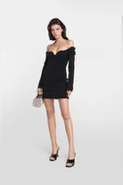 Elegant black dress featuring a bardot neckline and fitted silhouette.