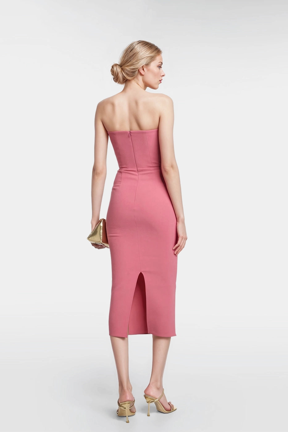 "Flowing pink midi dress with a back slit for graceful movement."