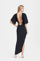 Jade Asymmetric Long Dress in black with thigh-high side slit and pleated waist.