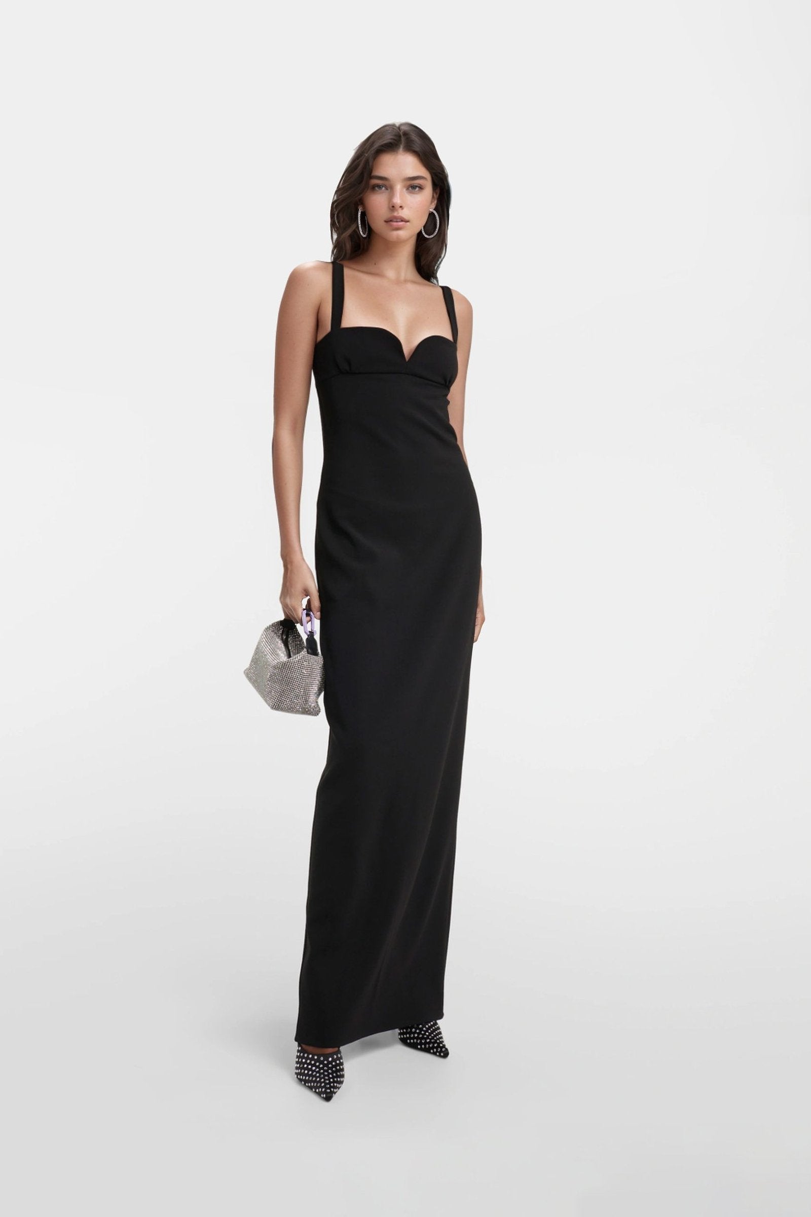 Stylish black maxi dress with an alluring open back design, perfect for any occasion.