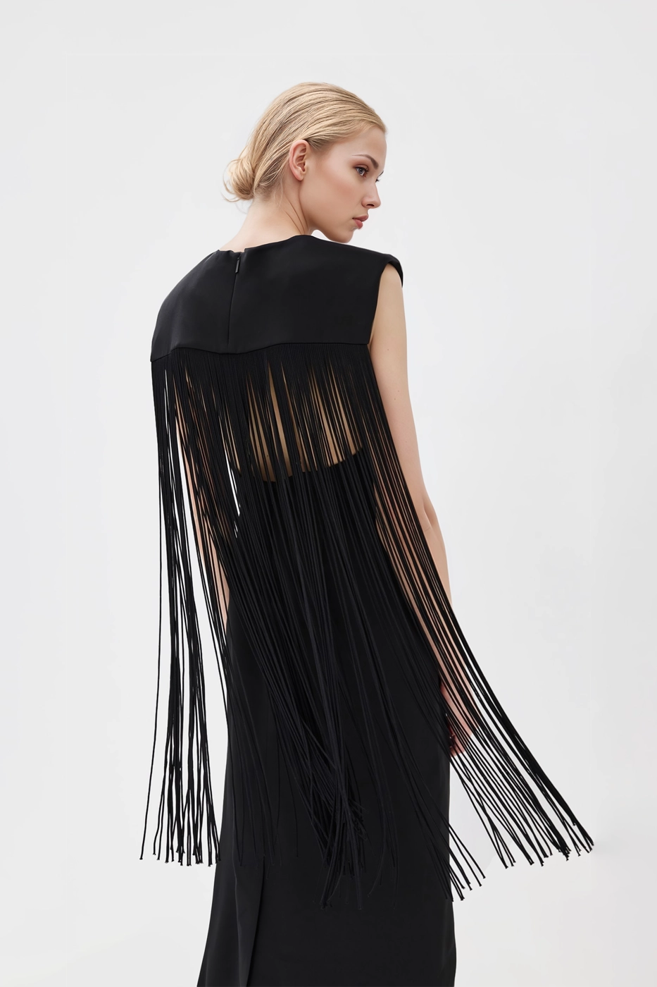 Clara Fringed Dress in black with a chic fringe overlay and adjustable shoulder straps.