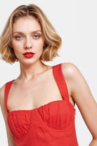 Vibrant red linen dress with a flared silhouette, ideal for summer events.