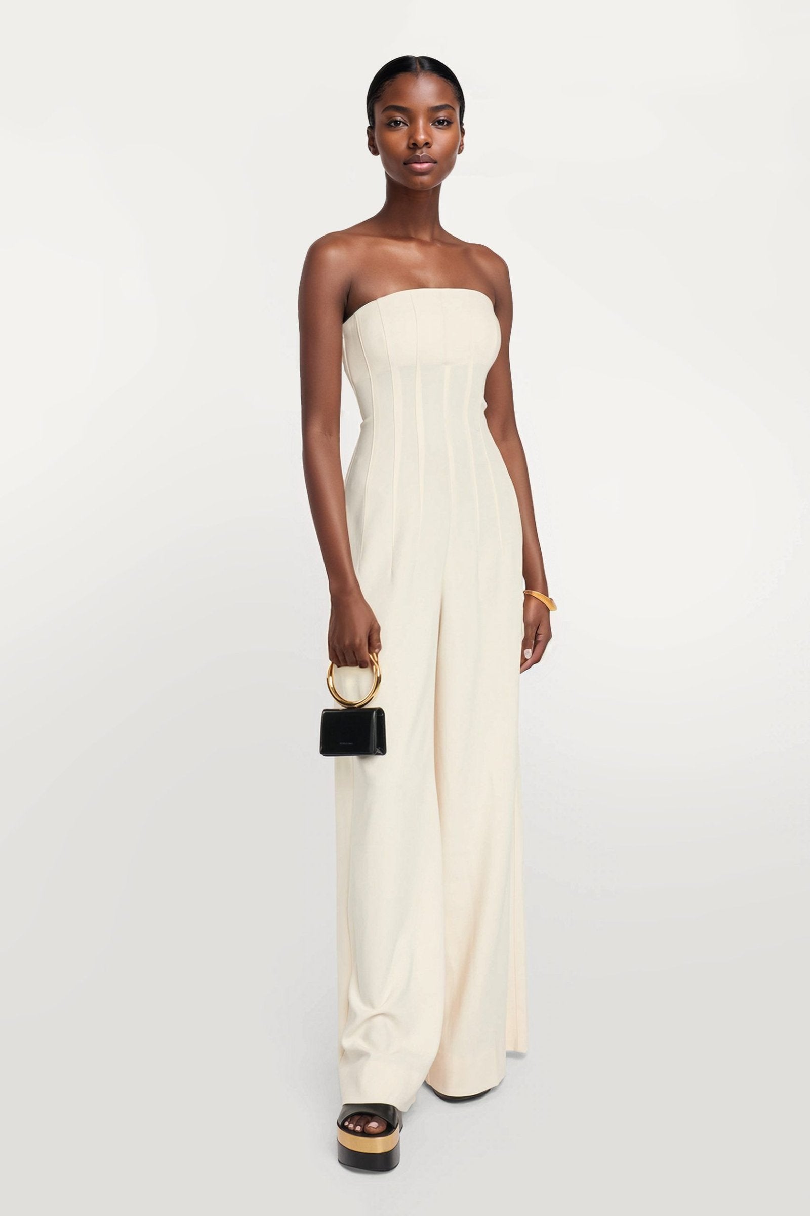 Chic off white jumpsuit featuring corset-style paneling.