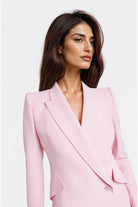 Elegant pastel pink blazer featuring button fastening and crepe fabric.