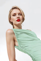 One-shoulder fitted dress in pale mint green, designed in Madrid.