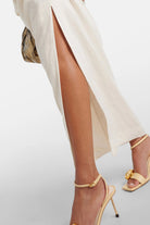 Liss Halterneck Linen Maxi Dress in off-white with drawstring detail.